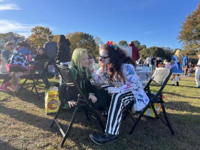 A costumed clown painted kids' faces at the event. 