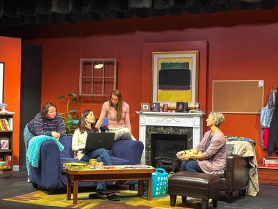 The three letter writers gather around Ruggiero's character as she shares advice. 