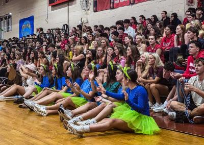 Senior students wave their hands in the air during their class skit, which had a "Toy Story" theme. Photos by Tanvi Kulkarni
