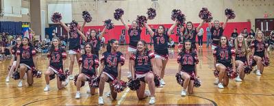 The cheer team performed a routine.