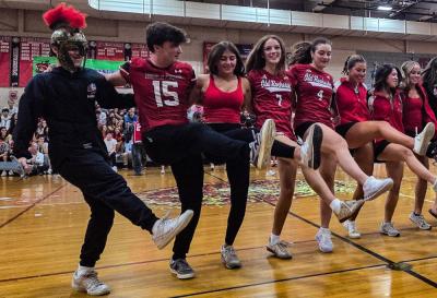 The junior class does a kickline during its class skit, modeled after the movie "The Odessey."