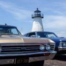 A Chevrolet Chevelle and Pontiac GTO sit parked with Ned’s Point Lighthouse as a backdrop on Sunday, June 28. Photos by: Tim Seeberger