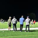 In this photo taken by Tabor sophomore Reya Hovan, Bill Belichick, second from the left, stands to watch the Tabor Academy football game. 