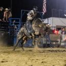 Derick Costa Jr. of Acushnet makes an eight-second bull-ride.