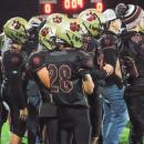 David Bryer stands with his team at the beginning of the game.