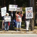 Protestors line up along North Street in Mattapoisett.