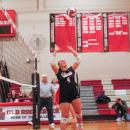 Senior Maya Morrison sets the ball.