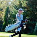 Brady Mills grabs his bag and moves down the course.  Brady Mills grabs his bag and moves down the course.