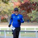 Michael Fay smiles as he finishes a hill. 