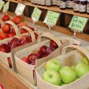 A large assortment of apples from local growers on display.