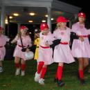 Girls dressed from the movie 'A League of Their Own' take on the costume contest.