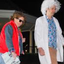 Marty McFly and Doc Brown dance along in the adult costume contest.