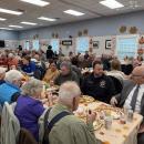 The room was packed with happy attendees.