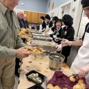 Students serve senior residents at the Rochester Council on Aging.