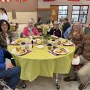 Happy faces spread throughout the cafeteria during the dinner.