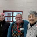 A group smiles before they head into dinner.