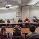 Mike Devoll leads a conversation between Old Rochester and Acushnet representatives.