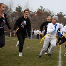 An Old Rochester player runs with the ball past Wareham’s defense during the annual Powderpuff football game on Tuesday, Nov. 21. Photos by Sawyer Smook-Pollitt