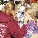 Norah Dawicki, 6, gets her face painted.