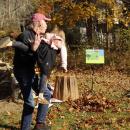 Vera volunteers to be tossed into a pile of leaves.