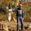 Gillman shows the audience how an apple picking sack functions.