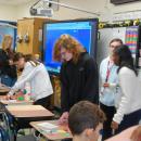 A high school student Henry Achilles helps out at the school he used to go to.
