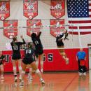 Molly Franco leaps to spike the ball. 