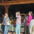 Guests chat as they make their way through the carriage house.