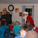 Santa chats with some more kids.