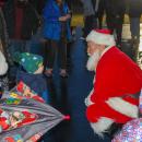 Santa says hello to children.