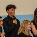 The Showstoppers honor the flag. 