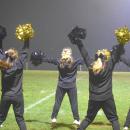 The cheerleaders cheer.