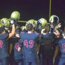 The team celebrates at the end of the game. 