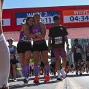 Pease crossing the Finish line of the Chicago Marathon in October of 2024 with her running partner, Kristen Wingate.