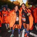 Pease after crossing the finish line of the NYC Marathon in November of 2024 with her running partner, Kristen Wingate.