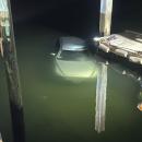 The car was 100 feet into the harbor when the Fire Department arrived.