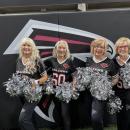 Elaine Botelho poses with the other cheerleaders from the original 1966 team.