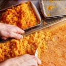 Doubrava scrapes sea buckthorn granita, a citrusy frozen dessert. Photo source: Simione Rusnak