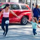 Kristie Simmons of Freetown reaches for her daughter’s hand at a Mother’s Day 5k on Sunday, May 11 in Mattapoisett. Photo by Abby Van Selous