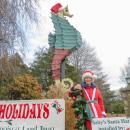 Mary Dermody poses in front of Salty the seahorse wearing the new hat she helped make. 