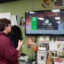 Moskos shows how the repaired Xbox works. 