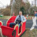 Marino Carrier sits in a sleigh on his front lawn, one of the many decorations at the Mattapoisett resident's house. Photo by Grace Roche