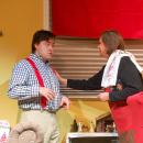 Tristan McCann, who plays Mickey, and Michele Letourneau, who plays Emily Gorski, chat in the characters' living room. 