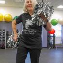 Botelho smiles with her pom poms.