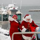 Mrs. Clause is waves to the crowd.