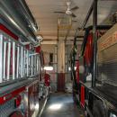 Both fire trucks parked in the fire station garage.