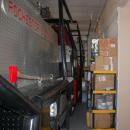 The fire engines are parked inches from the walls. 