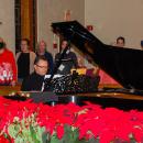 Darry Dolezal, the director, leads the group in vocal warmups.