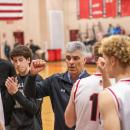 Steve Carvalho, middle, leads the Old Rochester Boys Basketball team in a pre-game speech before taking on West Bridgewater High School Friday, Feb. 14. Photo by Bobby Grady