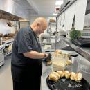 Danny Minkle working out of his kitchen at the Stone Path Malt. Minkle is from Onset and works out of Frogfoot Farm with the Marion Institute to feed people experiencing homelessness. Photo by Brandy Muz